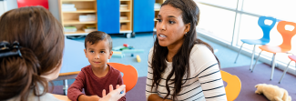 Parent, child and teacher having a discussion